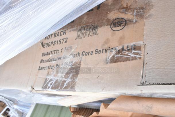 Box labeled "600PS1572 Pot Rack" from Regency, indicating a new stainless steel pot rack. Visible barcode and NSF mark.