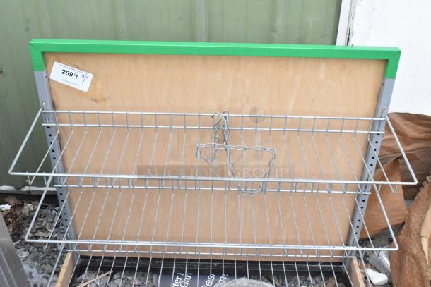 Gray 3-tier metal shelving unit with chain, tag labeled "2694." Appears in good condition.