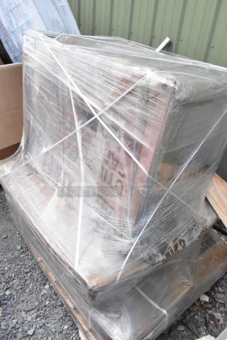Sealed pallet with brand new scratch and dent items: Lancaster table, Regency work table, and NSF wire shelf. Plastic wrap intact.