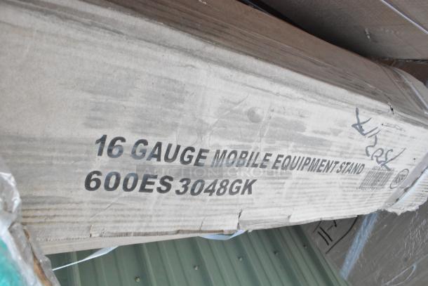 16 Gauge Mobile Equipment Stand box labeled 600ES3048GK. Auction includes new scratch and dent stainless steel items.