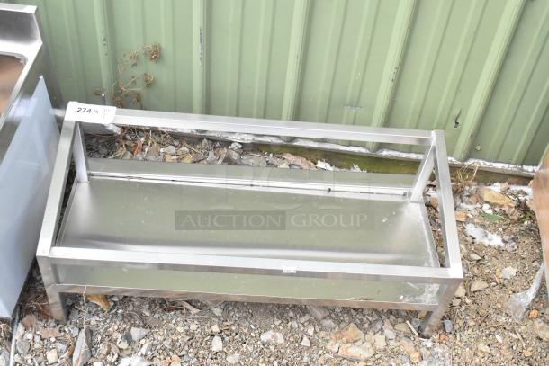 Brand new metal unit with visible scratches and dents, made of stainless steel. Item tag showing "274, Qty 1".