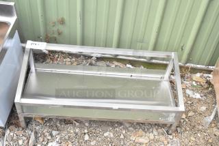 Brand new metal unit with visible scratches and dents, made of stainless steel. Item tag showing "274, Qty 1".