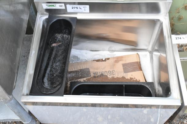 Brand new Regency 600IB1824 18"x24" underbar ice bin with 7-circuit cold plate, bottle holders, minor scratches visible.