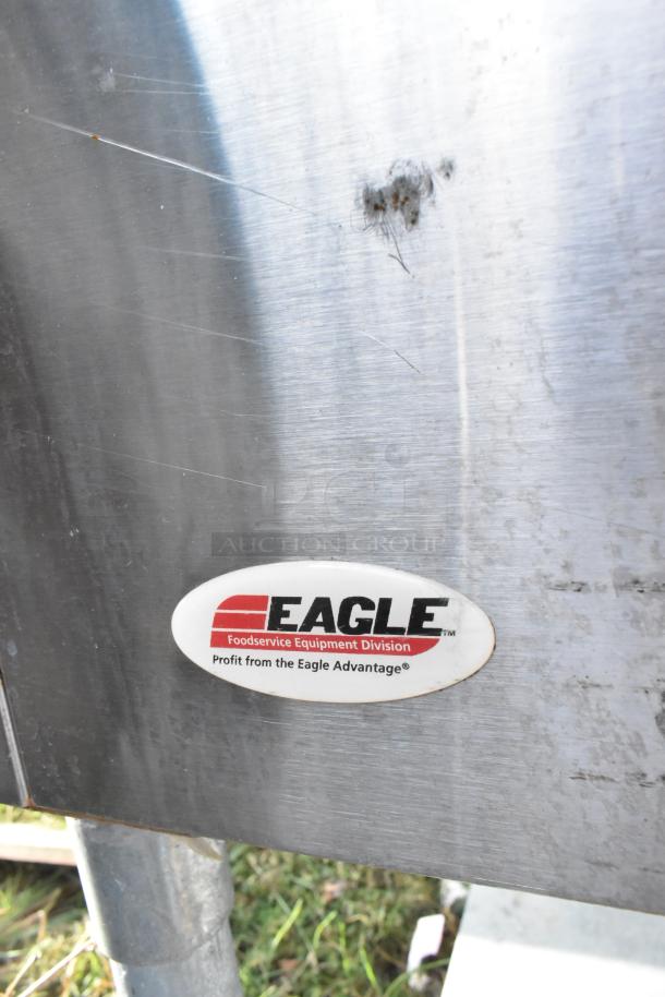 Eagle stainless steel 4 bay steam table with metal under shelf, showing brand label. Used condition with surface marks.