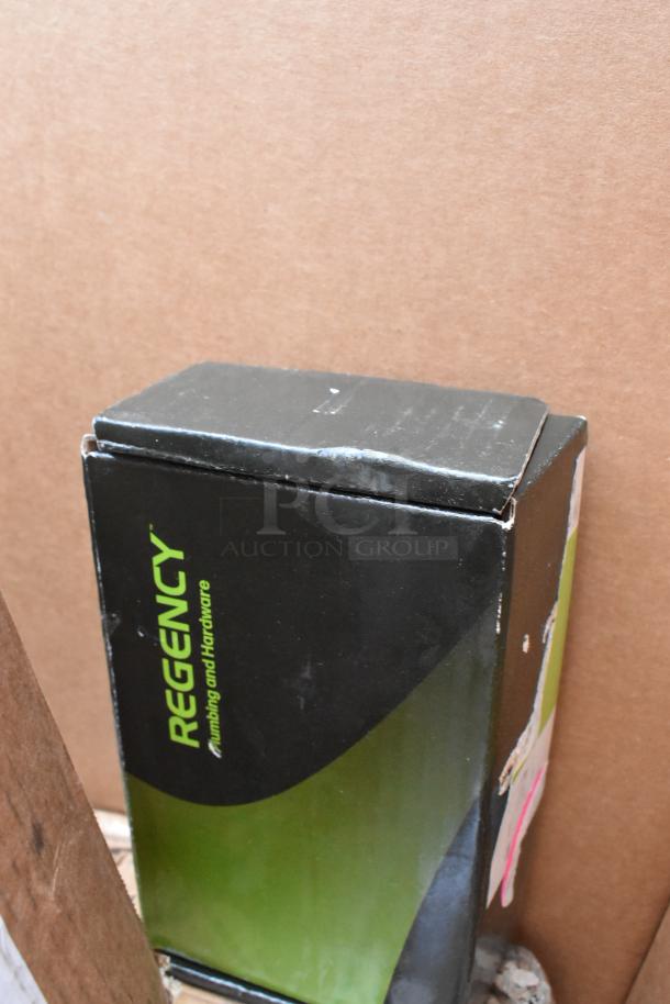 Regency Plumbing and Hardware box, slightly worn, containing brand new scratch and dent items for auction.