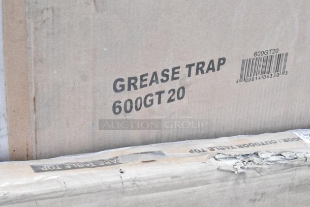 Cardboard box labeled "GREASE TRAP 600GT20" with a visible barcode and markings. Brand new condition.