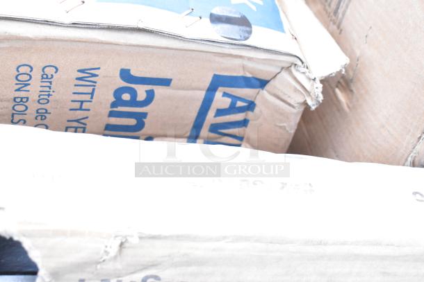 Boxes containing new scratch and dent items, including Regency grease trap and work table, and Lavex janitor cart kit.