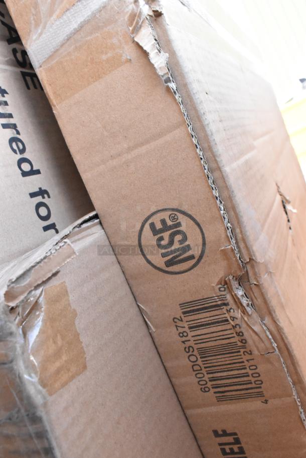 Damaged boxes with visible 600DOS1872 barcode and NSF mark; contains Regency stainless steel double deck overshelf.