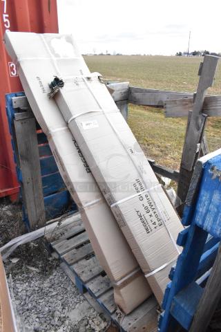 Two packaged Regency storage items, including a 14"x60" NSF green epoxy wire shelf and an 18"x72" stainless steel double deck overshelf. Boxes show minor damage.