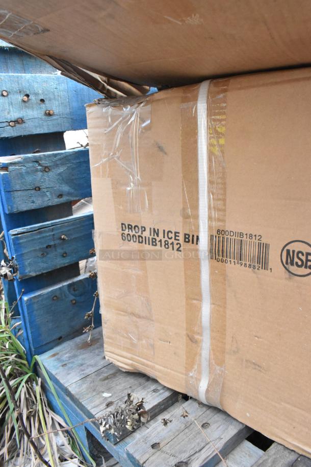 Cardboard box labeled "600DIIB1812 Drop-In Ice Bin" with visible tape and barcode, resting on a blue pallet.