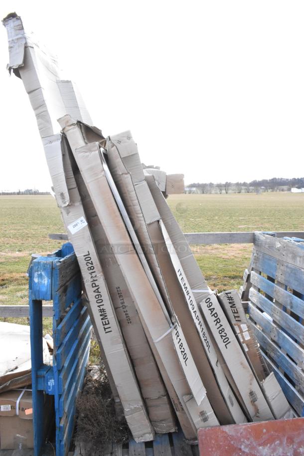 Eight new items in boxes, including Four 109APR1820L Regency 20 Pan Racks and Steelton 24x60" Work Table, slight box wear.