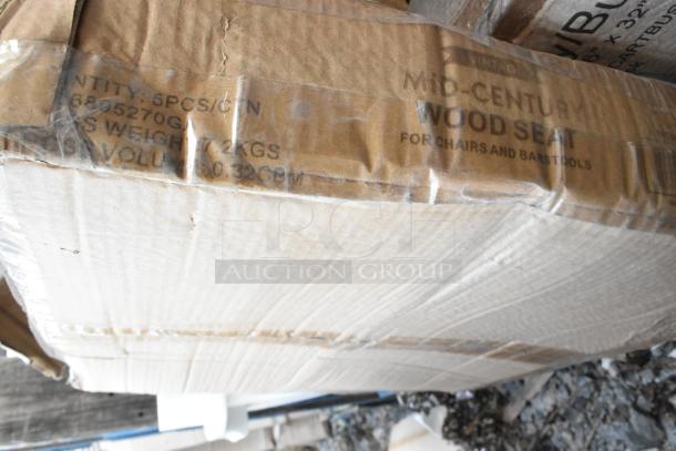 Cardboard box labeled "Mid-Century Wood Seat" with details for chairs and bar stools. Box shows signs of wear.