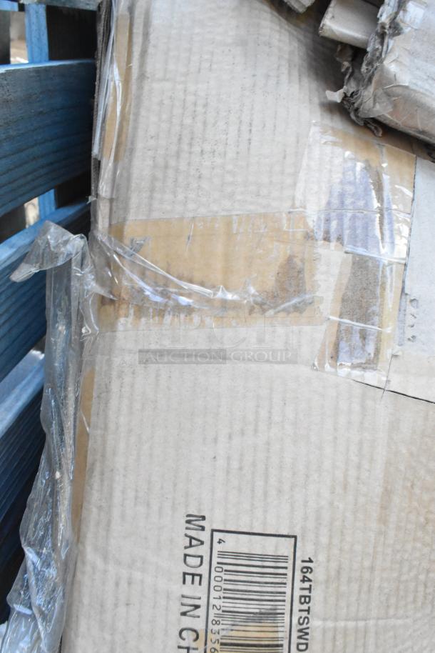 Cardboard box labeled "164TBTSWD." Items inside include chairs and other new, scratch and dent items. Made in China.