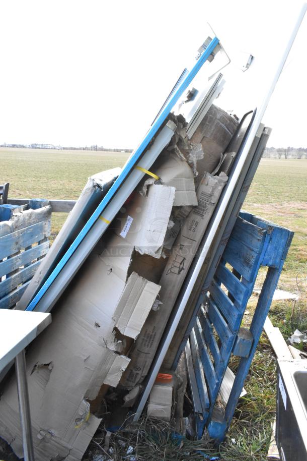 11 brand new items including scratched and dented Regency 600WS1860HD stainless steel 18" x 60" wall shelf, visible damage.