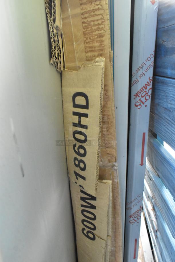 Cardboard box marked "600WS1860HD" containing Regency 16-gauge stainless steel 18" x 60" wall shelf. 