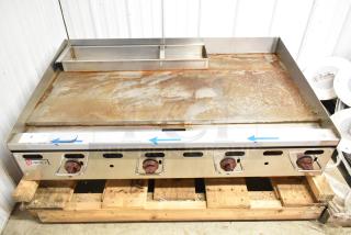 Wolf AGM48-101 stainless steel commercial flat top griddle, natural gas, 108,000 BTU. Moderate wear, visible surface rust.