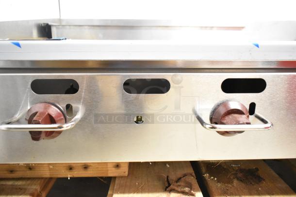 Wolf AGM48-101 stainless steel griddle, natural gas, 108,000 BTU, commercial countertop, visible control knobs.
