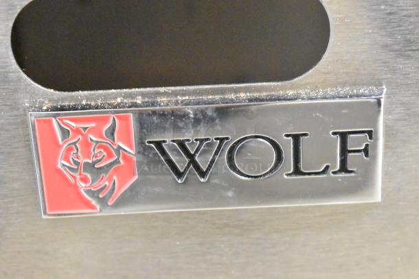 Wolf AGM48-101 stainless steel commercial griddle with logo, natural gas, 108,000 BTU. Ideal for high-capacity cooking.