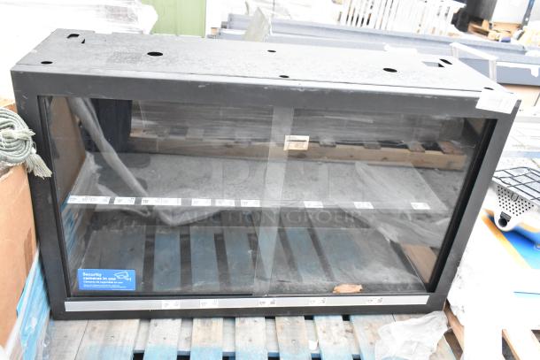 Metal 2 Door Dry Merchandising Cabinet, black, glass front, minor wear, security label visible, suitable for display use.