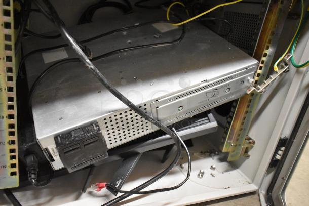 2 BlackShields DC0300 white metal air-conditioned technology cabinets with visible wiring and components. Excellent condition.