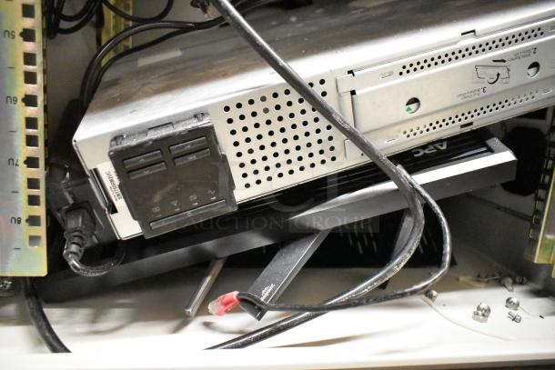 2 BlackShields DC0300 white metal air conditioned technology cabinets, cables and components visible, used condition.