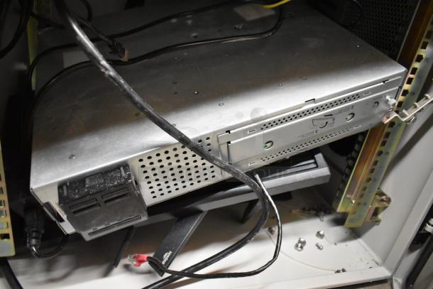 2 BlackShields DC0300 white metal air-conditioned technology cabinets, cables and components visible, model labels present.