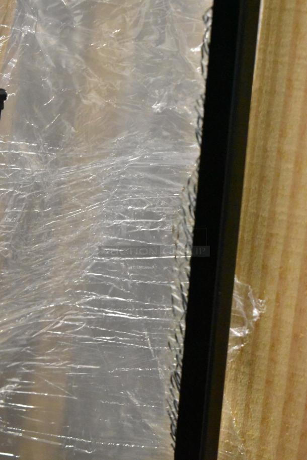 Brand new Hussmann MDN-4775B1A black vertical open air curtain merchandiser, scratch and dent condition, in packaging.