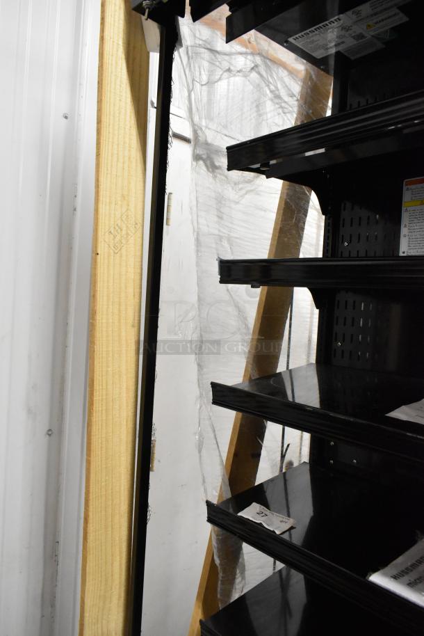 Brand new Hussmann MDN-4775B1A 47" black vertical open air merchandiser. Minor scratches visible. Labels indicate model details.