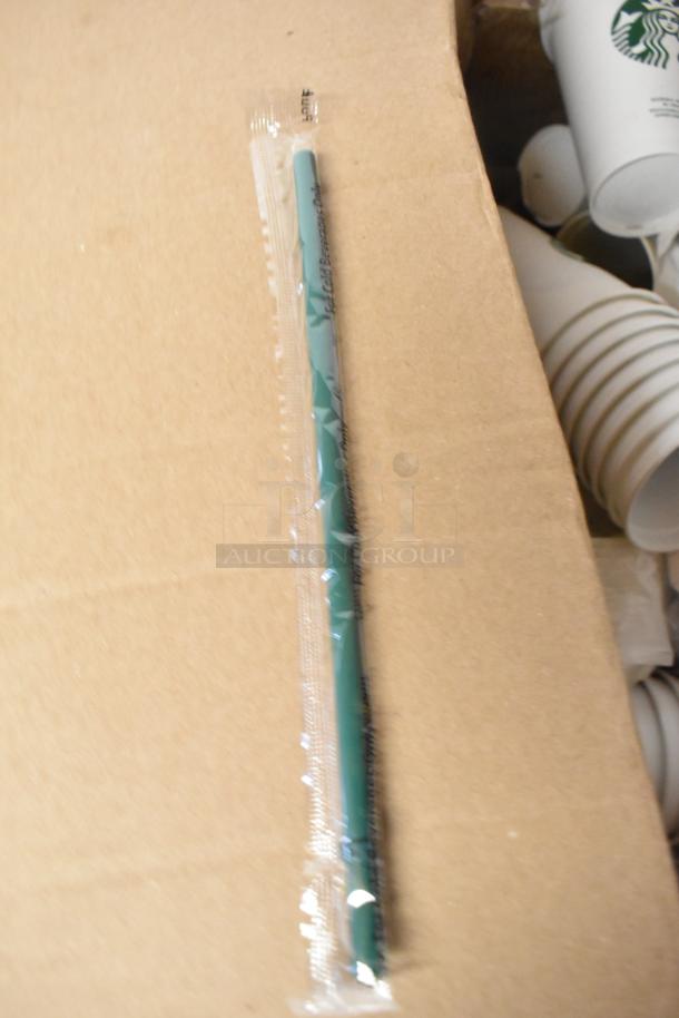 Lot of various items including sealed green straw, paper Starbucks cups, and metal tongs. Suitable for collection or use.