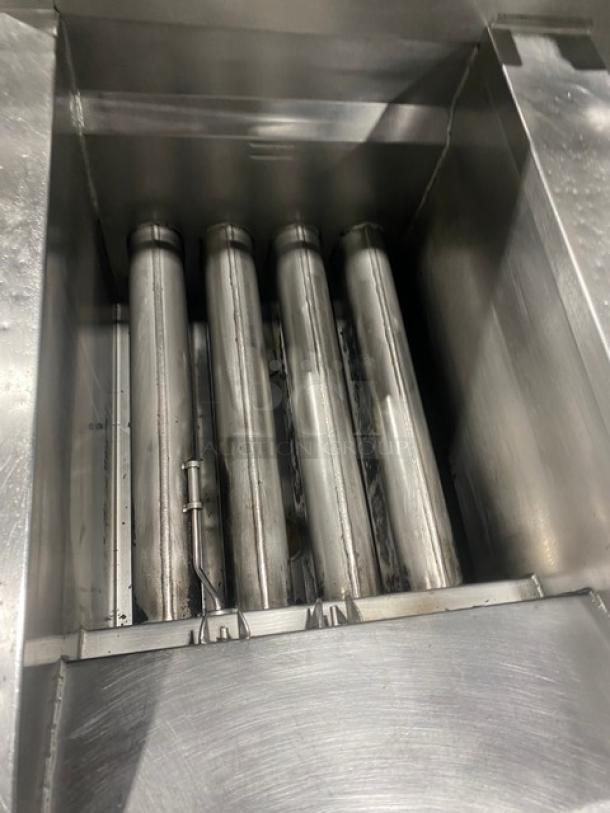 Henny Penny Evolution Elite Series deep fryer, model EEG253, stainless steel, triple bay, with back splash, on casters.