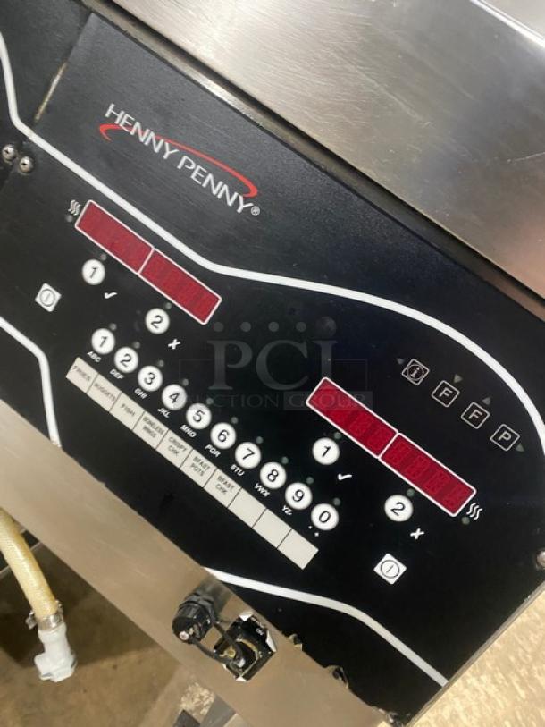 Henny Penny Evolution Elite Series triple bay fryer, model EEG-253, stainless steel, on casters, with control panel.