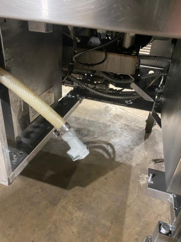 Henny Penny Evolution Elite stainless steel triple bay fryer, model EEG-253, on casters. Natural gas powered.