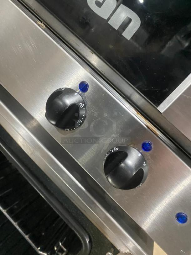 Moffat Turbofan E23M3 convection oven controls. Stainless steel, visible temperature dials, blue indicator lights.