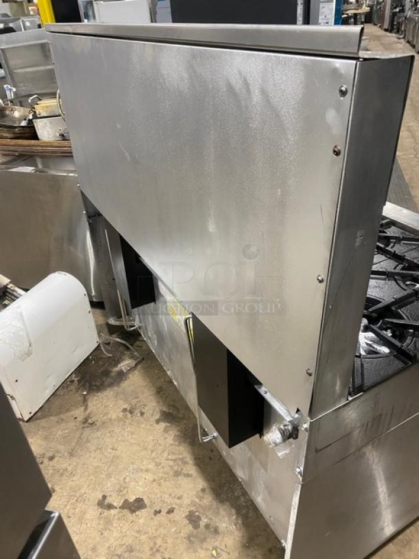 Garland commercial stainless steel gas-powered 10-burner range with double oven, backsplash, and wired oven rack on casters.