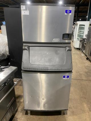Manitowoc Indigo Series stainless steel ice machine/bin combo, electric-powered, on legs, good condition, visible labels.