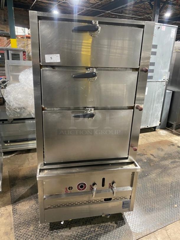 Commercial stainless steel 3-compartment seafood steamer with individual controls and wired oven rack, on legs.