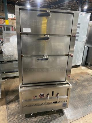 Commercial stainless steel 3-compartment seafood steamer with individual controls and wired oven rack, on legs.