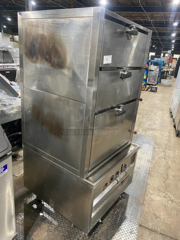 Commercial stainless steel gas-powered 3-compartment seafood steamer with individual controls, wired oven rack, and sturdy legs.