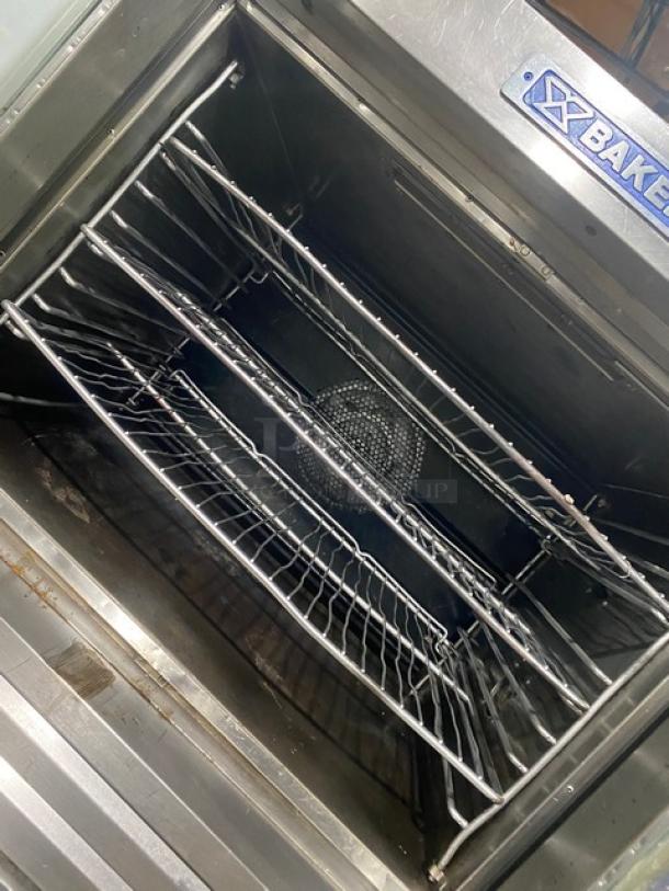 Bakers Pride Cyclone Series double-stacked convection oven, model CO11G1, stainless steel, includes wired rack, on casters.