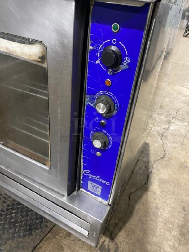Bakers Pride Cyclone CO11G1 convection oven, stainless steel, gas-powered, control panel visible, on casters, includes wired oven rack.