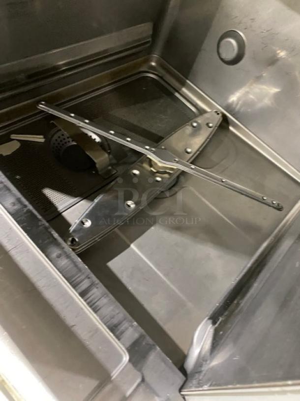 Hobart LXEH commercial dishwasher interior, stainless steel, undercounter design, high-temp wash, full-size peg rack.