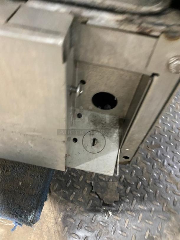 Hobart LXEH commercial dishwasher, stainless steel, electric, high temperature, visible lock mechanism detail.