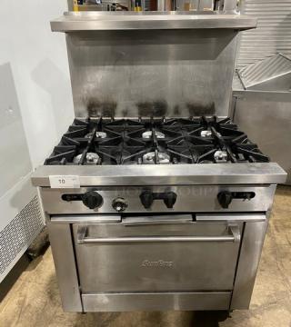 SunFire stainless steel 6-burner range/oven combo with back splash, overhead salamander shelf, and wired oven rack on casters.