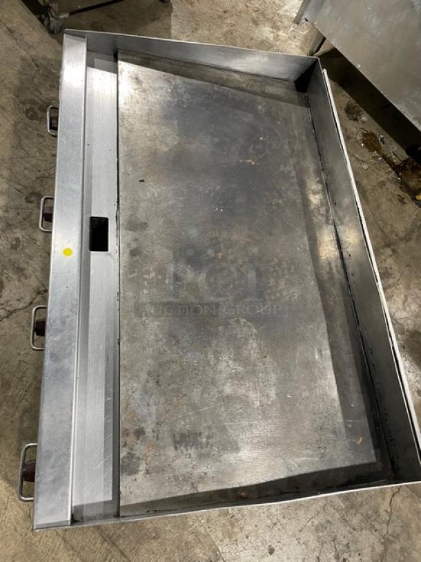 Wolf commercial stainless steel gas griddle with back and side splashes. Countertop model on legs, used condition.