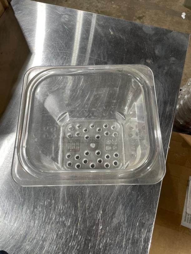 Cambro Camwear 1/6-size clear colander pan, model 65CLRCW135, 5" deep, new condition, perforated bottom for drainage.