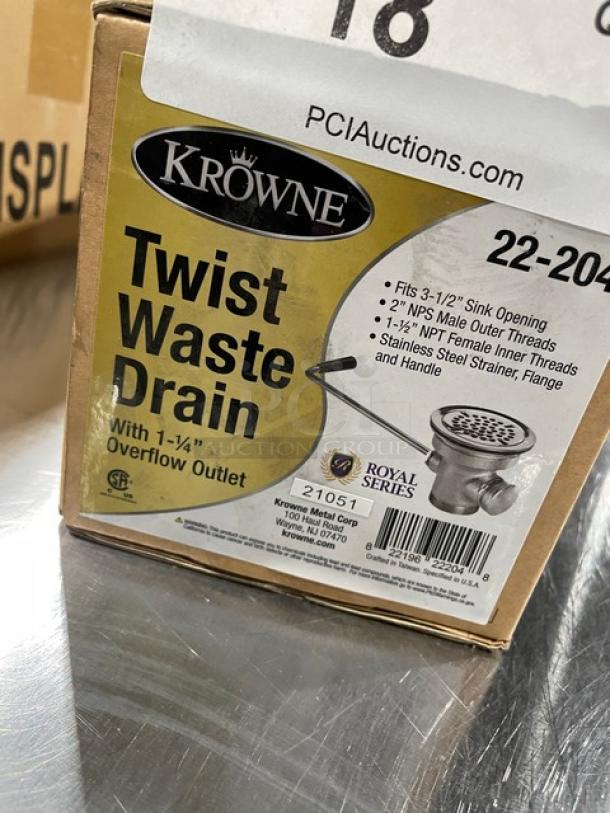 Krowne 22-204 commercial twist waste drain, new, with stainless steel strainer, flange, handle, and 1.25" overflow outlet.