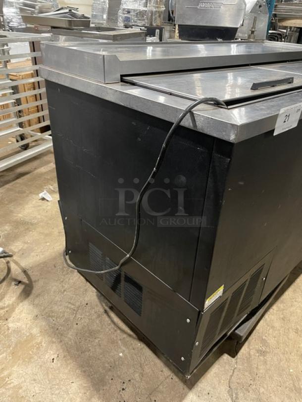 Beverage-Air DW49 black powder-coated 50" bottle cooler, stainless steel worktop, double sliding lids, 115V, used condition.