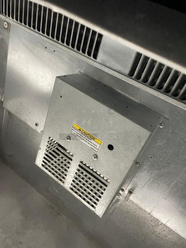 Beverage-Air DW49 deep well bottle cooler, black powder coated, with stainless steel worktop, double slide lids, caution label.