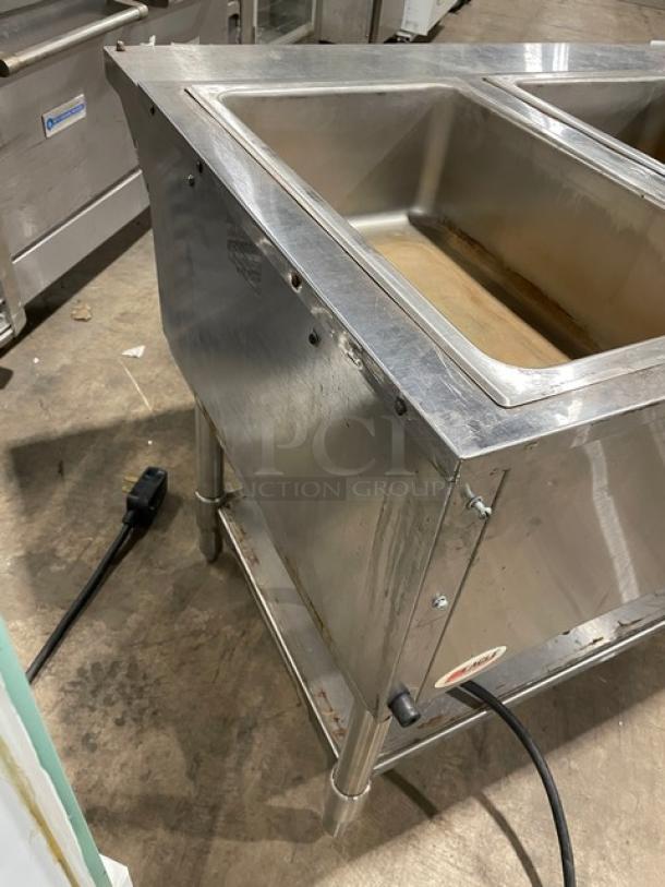 Eagle Group stainless steel 3-well electric hot food table with tray slide, single undershelf, and legs. Used condition.