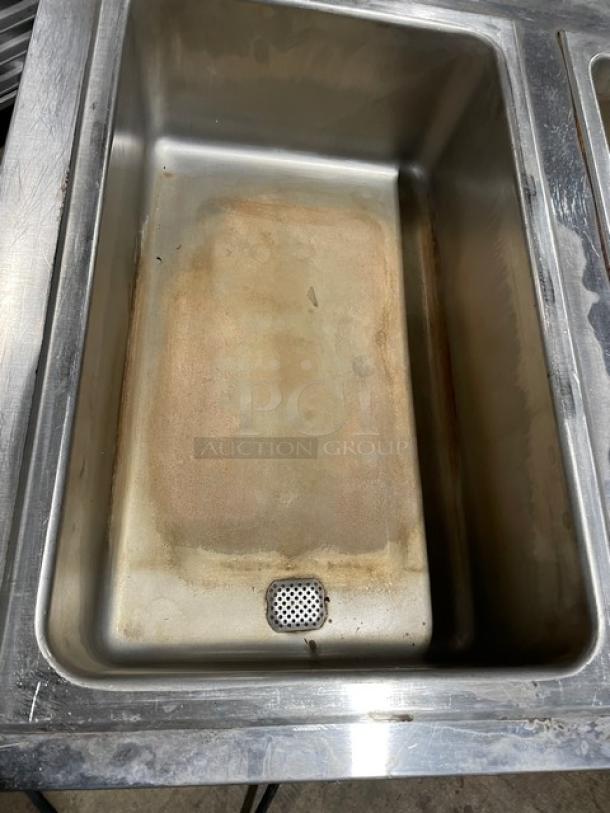 Eagle Group stainless steel 3-well hot food/steam table with tray slide and undershelf. Visible wear and discoloration.